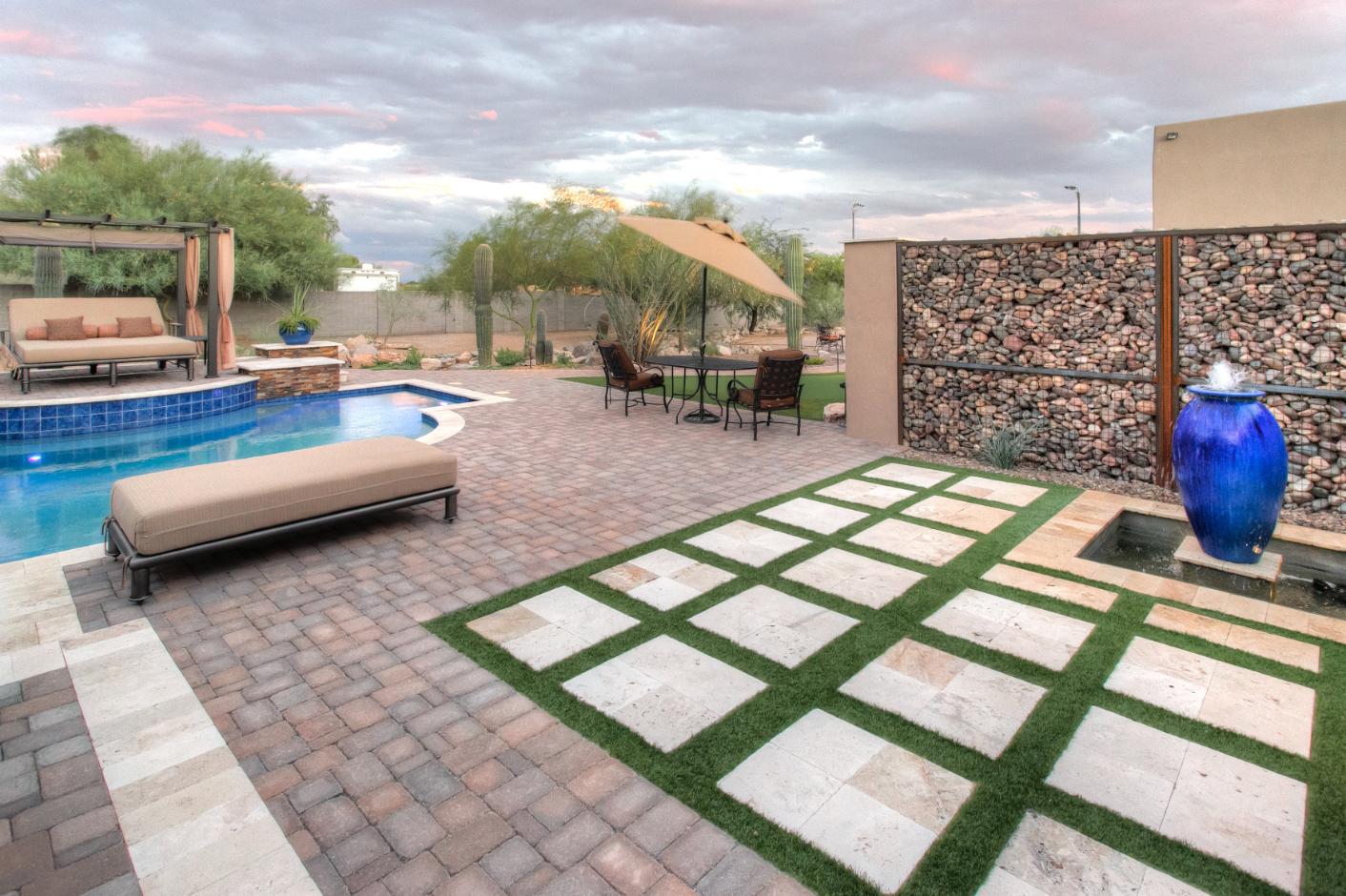 Desert oasis transformation with water feature and native plants